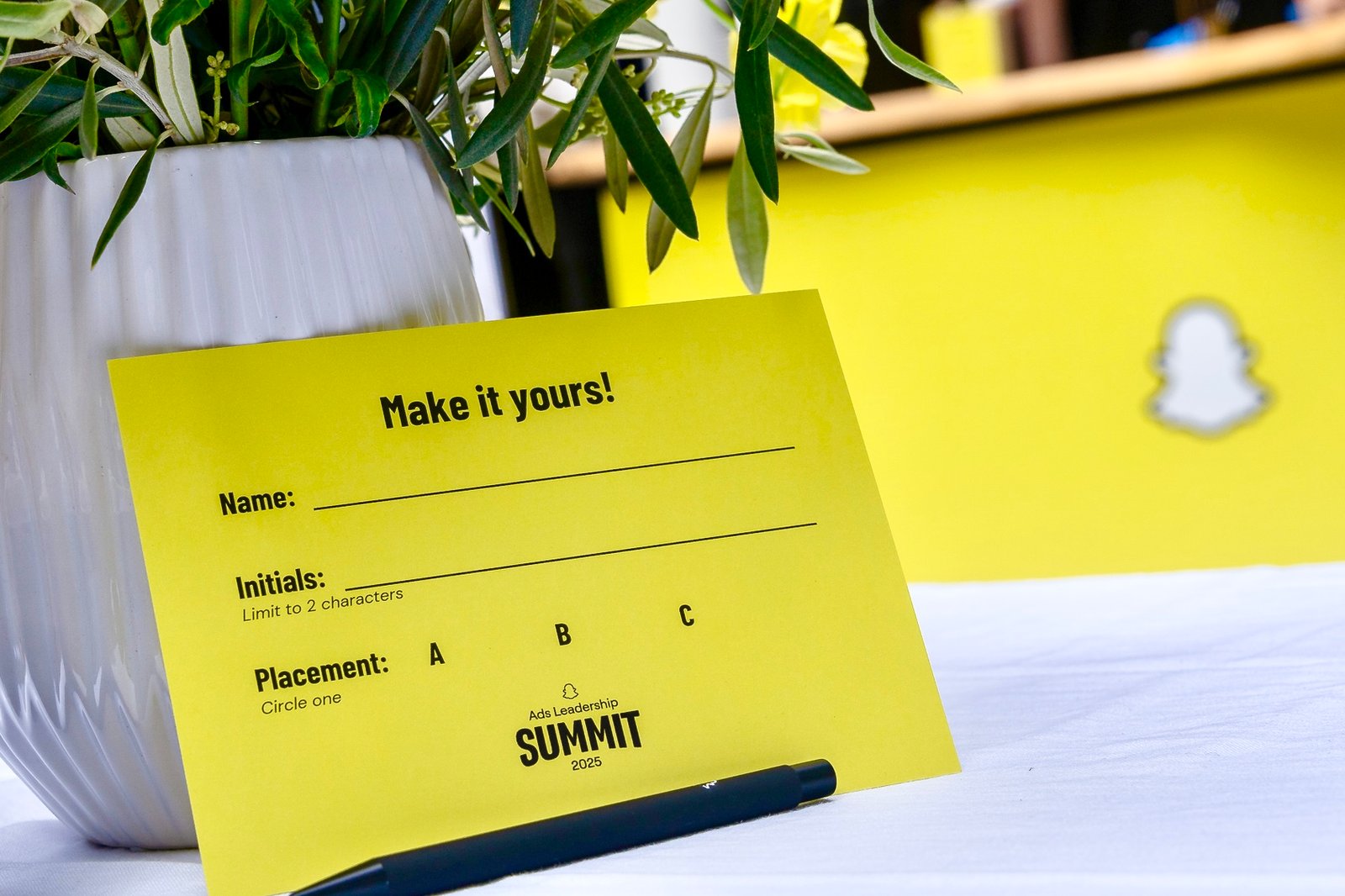 Personalization note card at Snapchat Leadership Summit 2025, used for guests to fill in their name, initials, and placement for embossing customization.