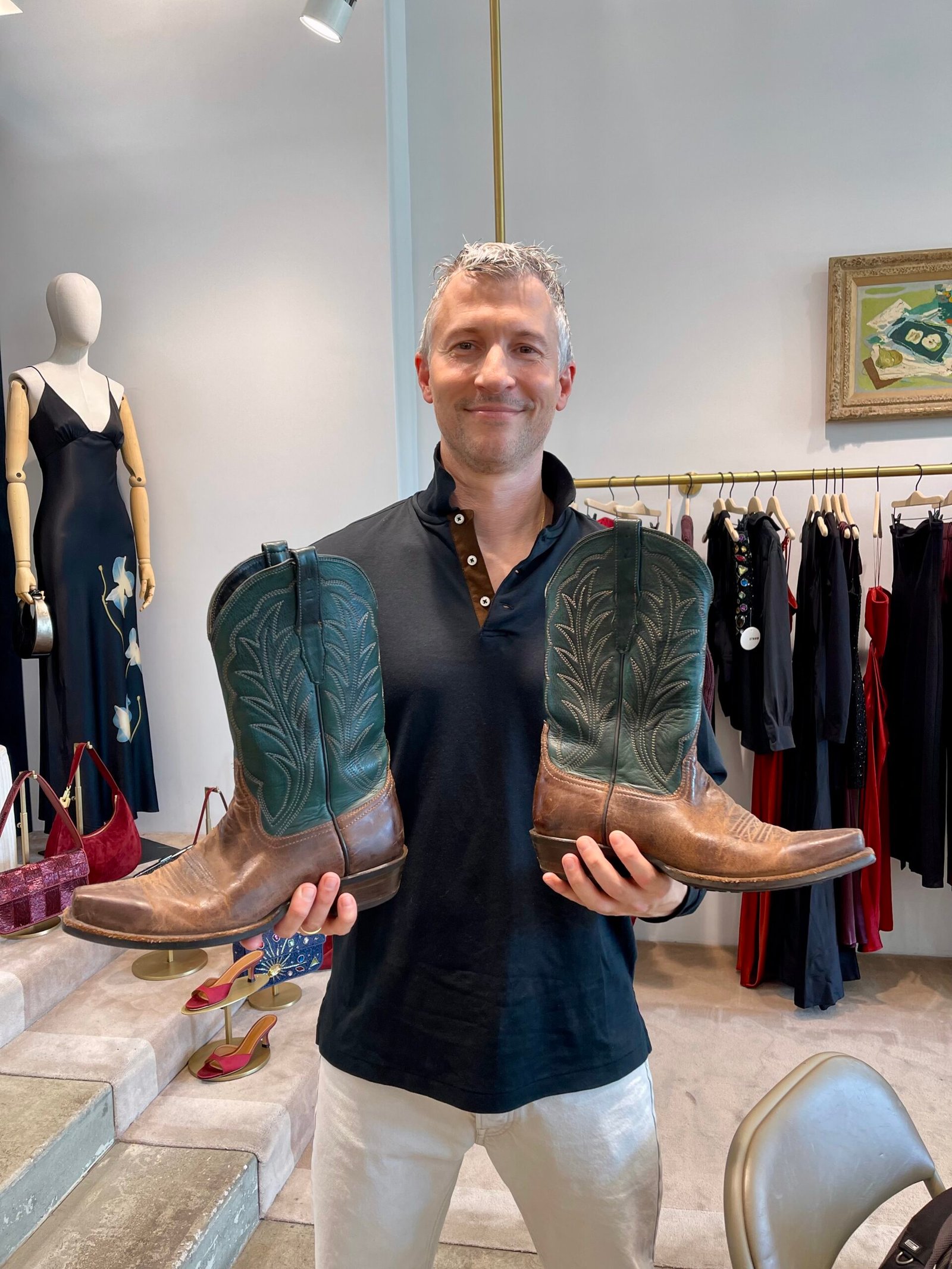 Personalized Wally Boots at Staud Melrose Guest smiling while picking up her personalized leather wristband at Rare Beauty’s 5th anniversary celebration.