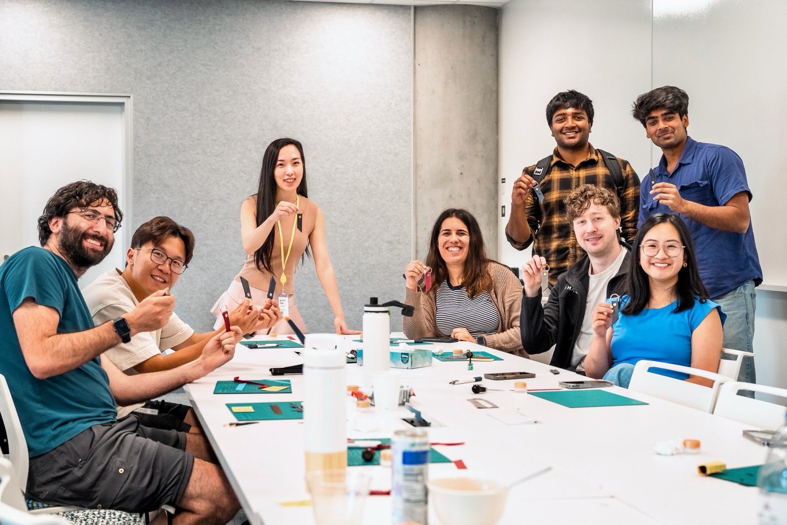 Walmart National Fashion Tour personalization station – western belts embossed with initials and rivet decorations under “Now Delivering Your Rodeo Dream” backdrop