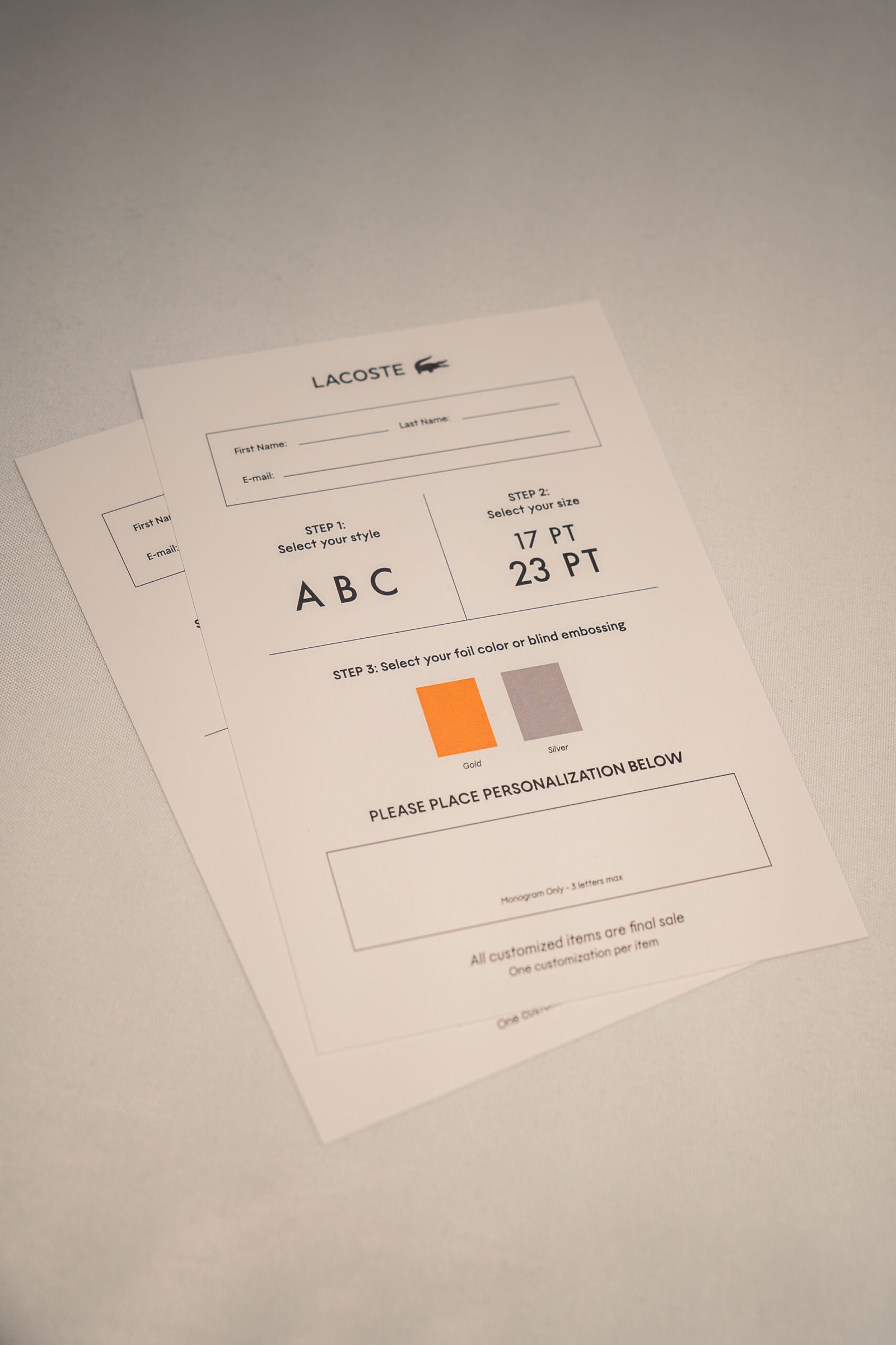 Walmart National Fashion Tour personalization station – western belts embossed with initials and rivet decorations under “Now Delivering Your Rodeo Dream” backdrop