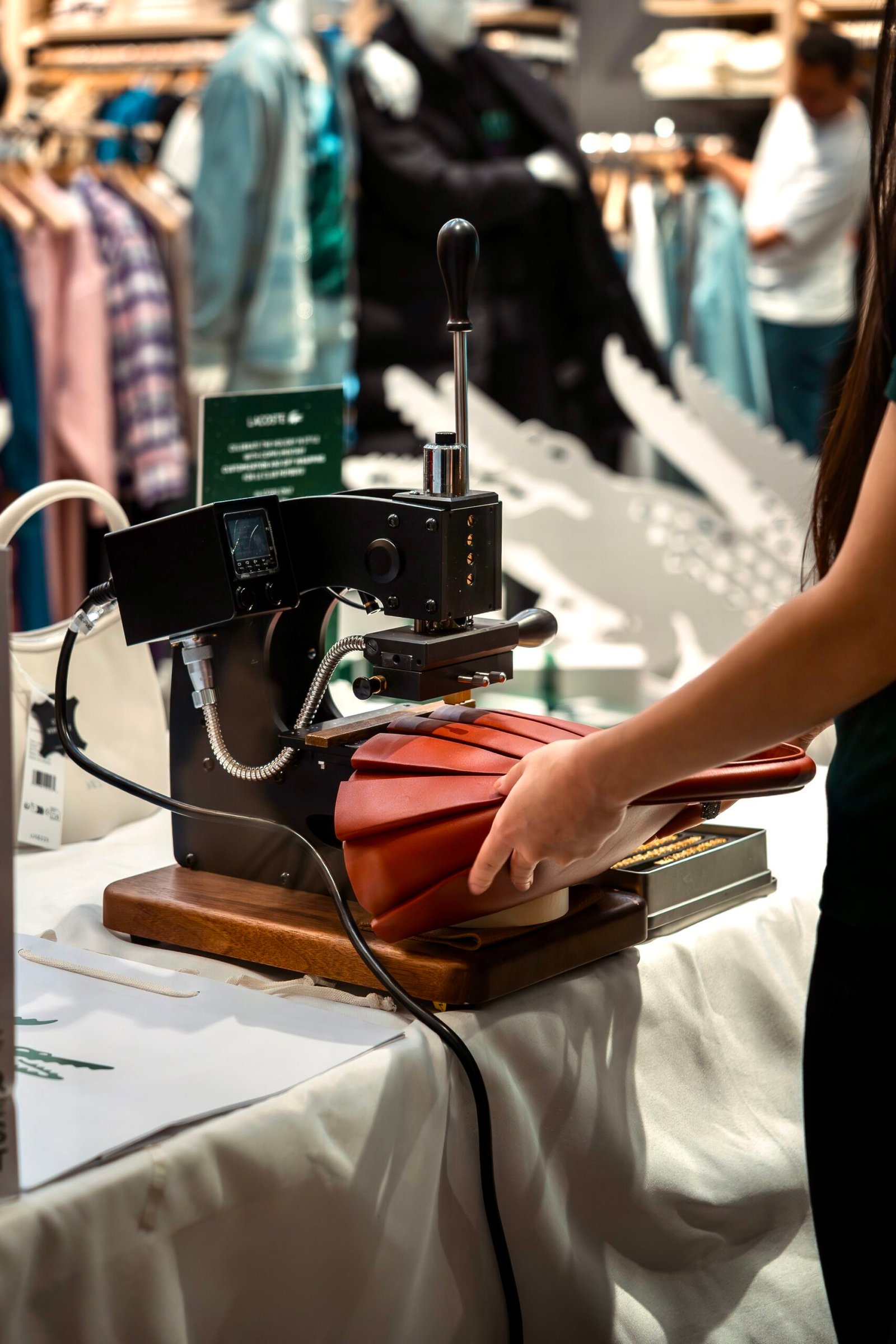 Black vegan leather license plate keychain with gold foil embossed initials SAK, created at Prime Video’s Maintenance Required premiere.