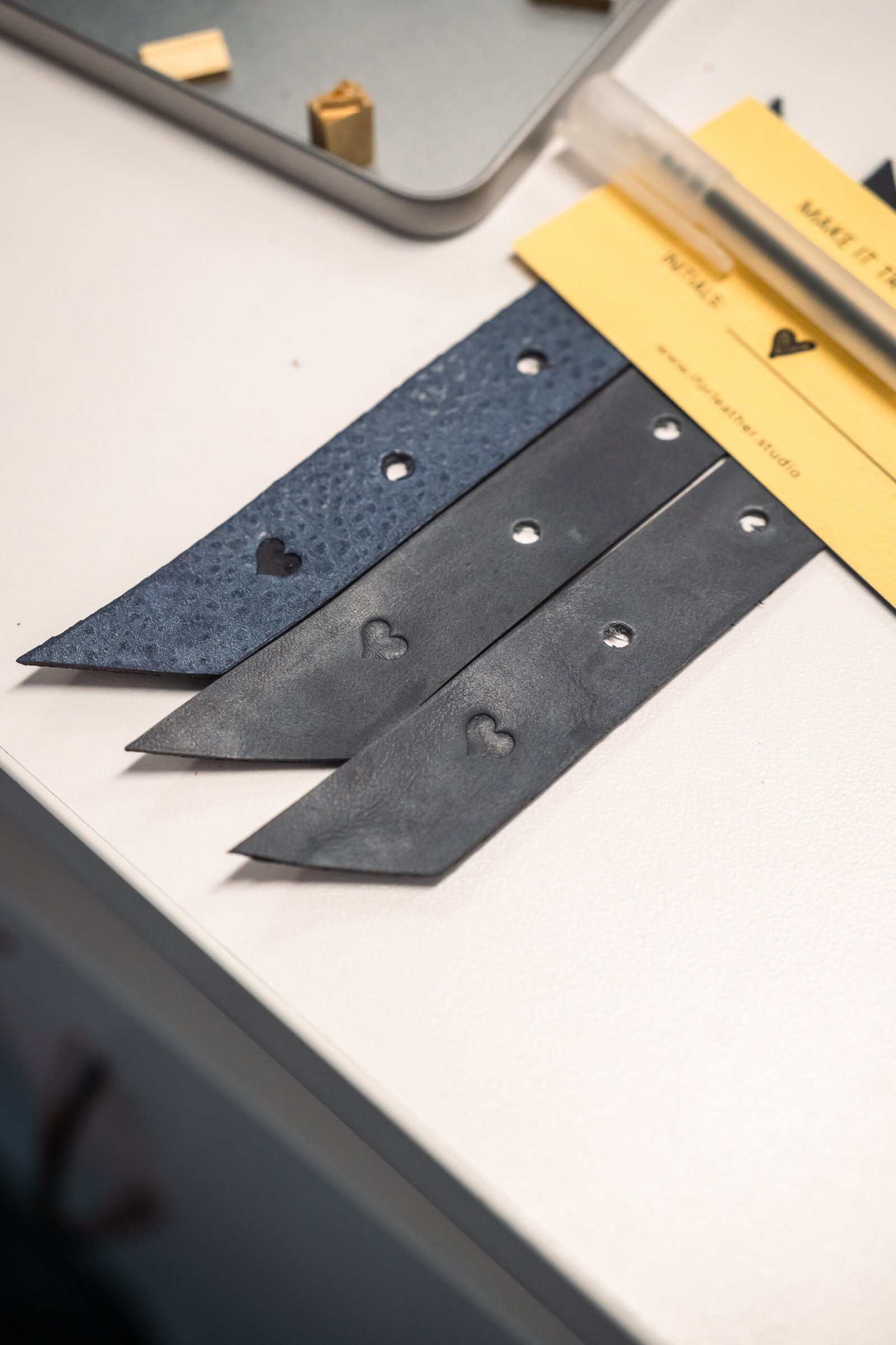 Two influencers capturing photos and videos of the onsite embossing station at Prime Video’s Maintenance Required premiere.