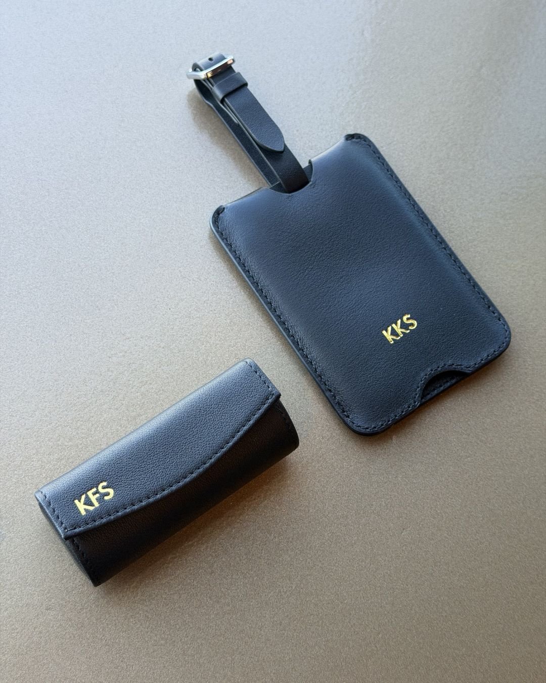 Gifts for Grammy Guests Black vegan leather license plate keychain with gold foil embossed initials SAK, created at Prime Video’s Maintenance Required premiere.