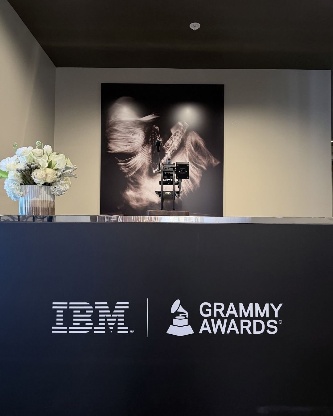 IBM Grammy Awards Maintenance Required movie poster displayed at a retro-style premiere venue for Prime Video’s film event.