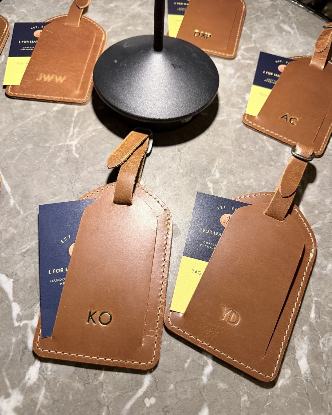 Monogrammed tags at CES Onsite embossing station at Lexus Pro Shop, Monterey Car Week 2025, Pebble Beach