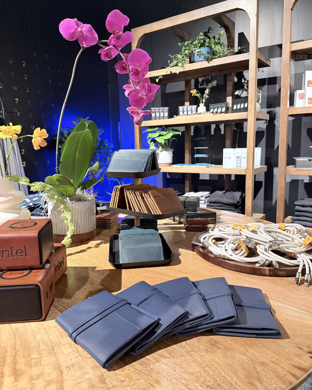 Two influencers capturing photos and videos of the onsite embossing station at Prime Video’s Maintenance Required premiere.