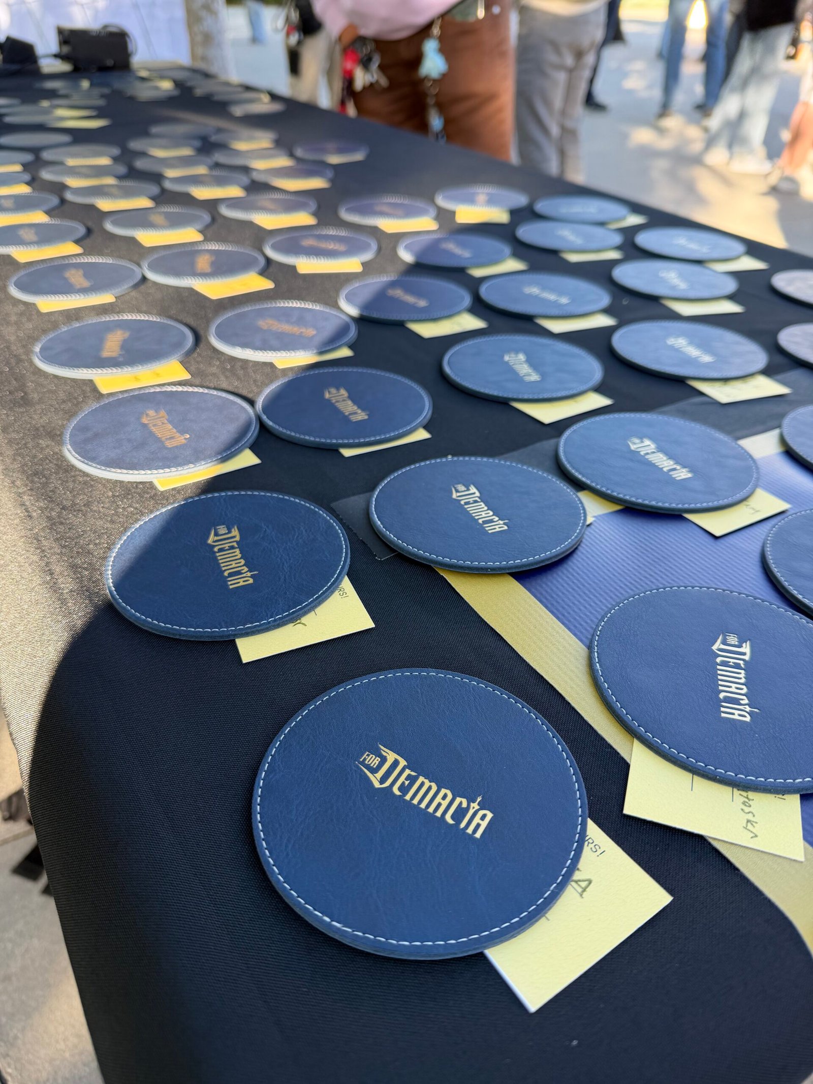 Walmart National Fashion Tour personalization station – western belts embossed with initials and rivet decorations under “Now Delivering Your Rodeo Dream” backdrop